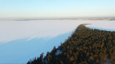 Flying over the forest. Flying over Cape. frozen sea. Stock Footage 60762696