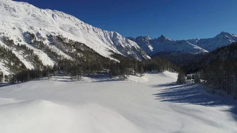 Flying over the forest in high mountain, winter season. Stock Footage 83443049