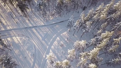 Flying over forest road crossing in winter Stock Footage 104427104