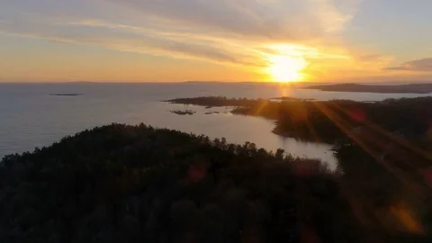 Flying Over Forest as the Sun is Setting by the Horizon. 4K Stock Footage 83251731