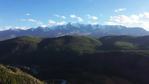 Flying Over Forests Massive Turning Into Mountain With Snow Capped Summits Stock Footage 167785662