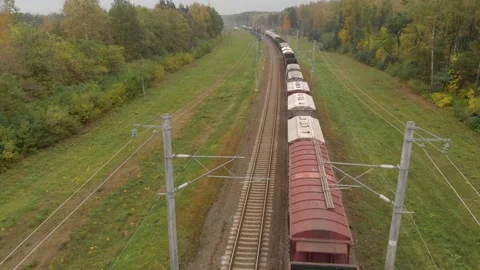 Flying over a freight train moving in the countryside Stock Footage 147849968