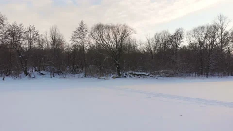 Flying over frozen river Stock Footage 103856725