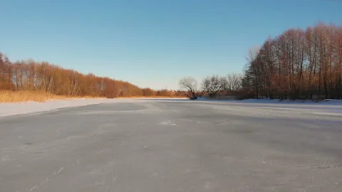 Flying over frozen river Stock Footage 104284464