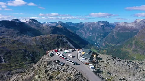 Flying over Geiranger Viewpoint surrounded by mountains and curvy roads Stock Footage 167263193