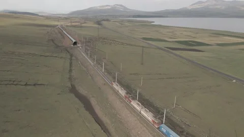 Flying over Georgian Railways train moving in beautiful alpine mountains 库存影片 161963462