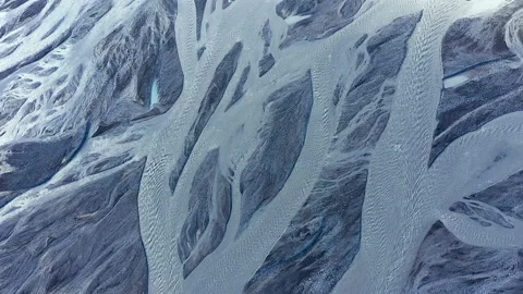 Flying over a  glacial river system from a melting iceberg, Iceland Stock Footage 140352084