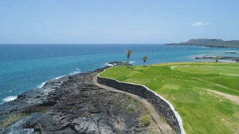 Flying Over Golf Course green field Towards Blue Ocean In Sunny Day Stock Footage 89629591