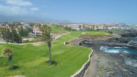 Flying over golf course green field with golf player In sunny day Video stock 90552883