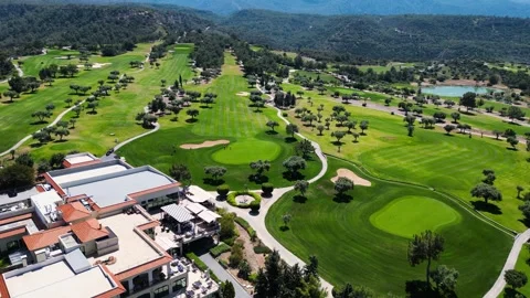 Flying over golf courses. Golf on holiday. Expensive green golf courses. Sea. Stock Footage 276295253