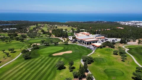 Flying over golf courses. Golf on holiday. Expensive green golf courses. Sea. Stock Footage 276295330