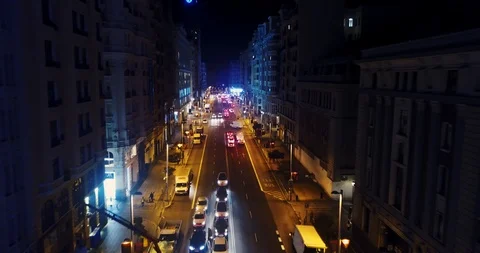 Flying over Grand Via street in Madri Spain at night Stock Footage