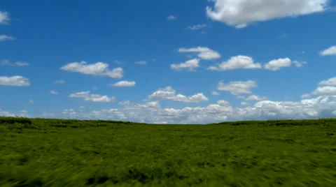 Flying over a grassy field Stock Footage 38615368