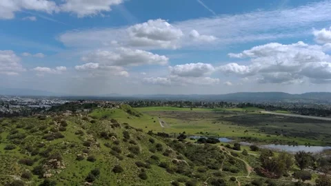 Flying over Grassy Hillside Stock Footage 241553598