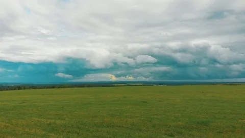 Flying over a green field Stock Footage 114348618