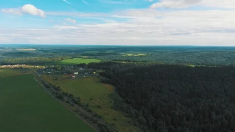 Flying over a green field Stock Footage 114348624