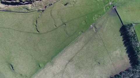 Flying over a green fields and stone quarry Stock Footage 73530159
