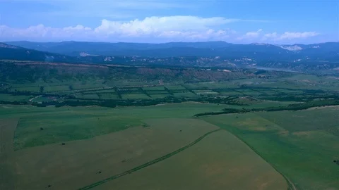 Flying over green fields Stock Footage 123273951