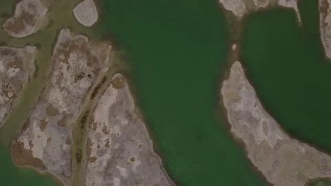 Flying up over green industrial mining lakes in Munich Stock Footage 220378178
