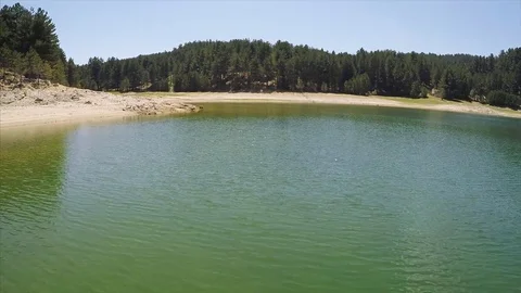 Flying over green lake Stock Footage 84313109