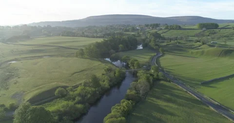 Flying over a green valley Stock Footage 133213363