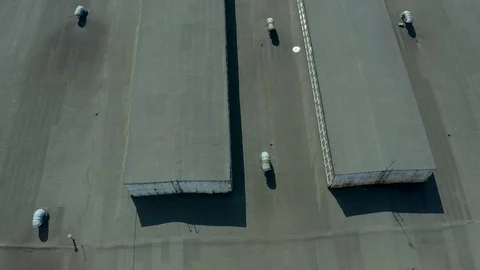 Flying over hangars for the storage of grain, industrial buildings, aerial Stock Footage 127715132