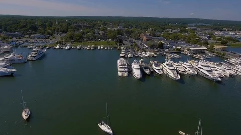 Flying over harbor to small town Stock Footage 108923370