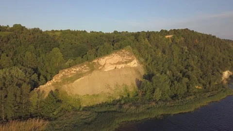 Flying over a high hill with green trees. Stock-Footage 112764007