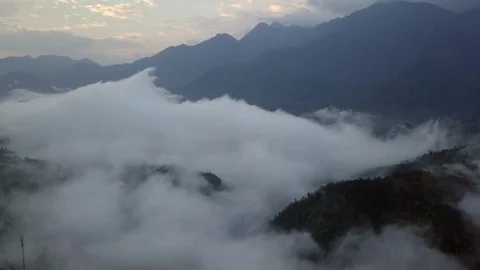 Flying over the high mountains in beautiful clouds Stock Footage 90901919