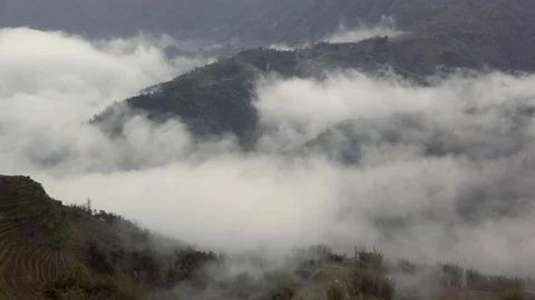 Flying over the high mountains in beautiful clouds Stock Footage 90903759