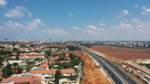 Flying over Highway 2 under construction. Israel Netanya AUG12 2022 Stock Footage 293232828