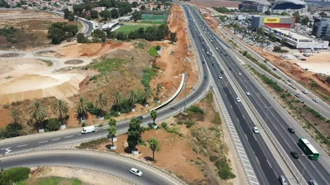 Flying over Highway 2 under construction. Israel Netanya AUG12 2022 Stock Footage 293233682