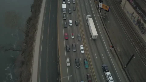 Flying Over Highway and River, Tilt Up to City Skyline Vídeos de archivo 233208064
