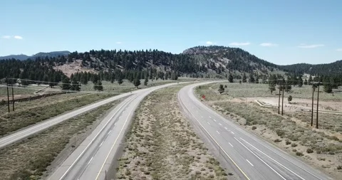 Flying Over the Highway in Eastern Sierra Nevada Mountains Stock Footage 219581306
