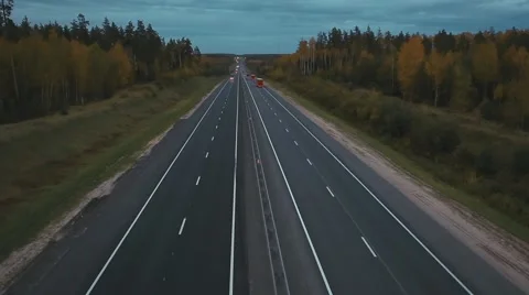 Flying over the highway in evening Stock Footage 68934348