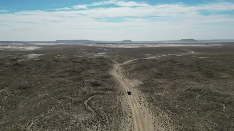 Flying over a highway in a mountain desert Stock Footage 237694289