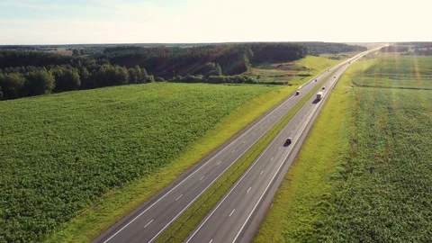 Flying Over Highway Road Where Trucks Transport Cargo And Cars Driving Stock-Footage 143389875