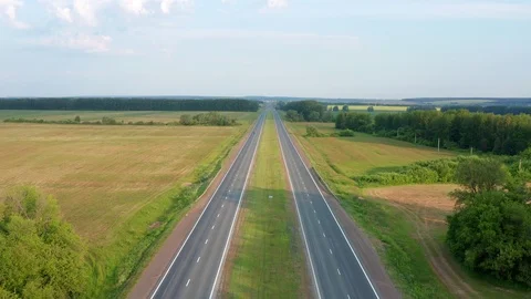 Flying over a highway with two oncoming lanes. Stock Footage 116809765