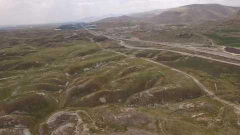 Flying over hills and roads in the middle of Jordan Valley. Israel. DJI-0004-04 Stock-Footage 123744005