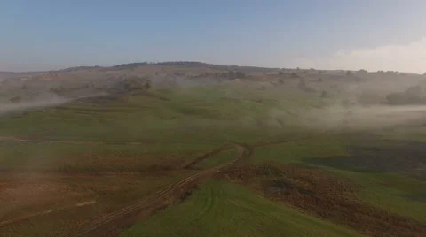 Flying over hills mist 動画素材 63535081