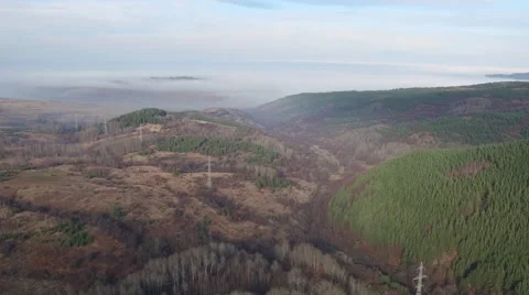 Flying over the hills from the top view of clouds Aerial slide shot 動画素材 58254154