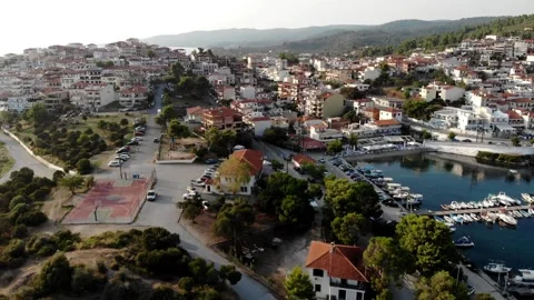 Flying over the hilly central part of Neos Marmaras city, Sithonia, Halkidiki Stockbeeldmateriaal 160617137