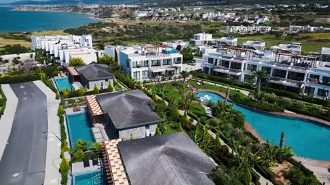 Flying over the hotels near the seafront. Expensive hotels on the sea. Beaches. Stock Footage 276295107