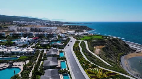 Flying over the hotels near the seafront. Expensive hotels on the sea. Beaches. Stock Footage 276295447