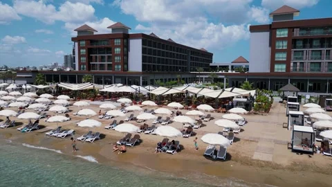 Flying over the hotels near the seafront. Expensive hotels on the sea. Beaches. Stock Footage 276295483