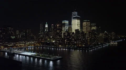 Flying over the Hudson toward Manhattan Financial District at night, near Stock Footage 59172143