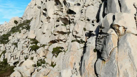 Flying over a huge cliff with bizarre shapes Stock Footage 128463821