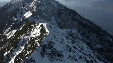 Flying over huge mountain peeks looking over Lake Garda, Italy Stock Footage 102498287
