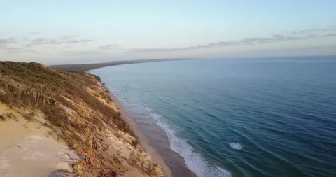 Flying over Huge Sand Dune Out To The Ocean | 4K Drone Aerial Footage Video stock 154015565
