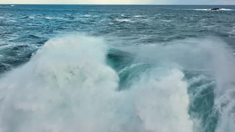 Flying over huge wave in atlantic ocean. Aerial filming breaking surf with foam Video stock 221247916